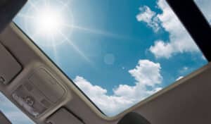 Sunlight Streaming Through Cars Sunroof, Highlighting Its Beauty And Providing A Serene Ambiance