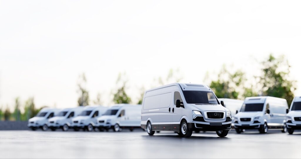 White vans parked in lot for fleet vehicle windshield repair and services